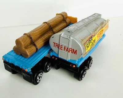 Micro Machines Semi Trucks #7 Lumberjacks Fertilizer Trailer & Log Hauler Lot - Image 1 of 4
