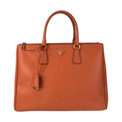Отличное состояние PRADA Saffiano оранжевый золото оборудование кожаная сумка с короткими ручками Дамская сумка - Изображение 1 из 4