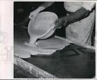 1967 Press Photo A Worker Pours Plaster Of Paris Over Clay To Make Mold