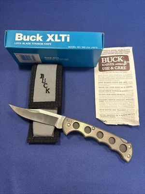 Cuchillo NOS BUCK MANGO TITANIO 560 XLTI Hecho en EE. UU. Nuevo En Caja Como Nuevo Foto 1 de 4
