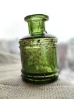 Antique inkwell 1800`s Old green glass. Small bottle. Beautiful glass