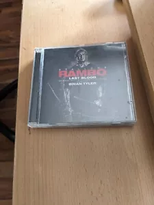 RAMBO LAST BLOOD - BRIAN TYLER - ORIGINAL SOUNDTRACK - JAPAN ONLY CD - wie - NEU - Foto 1 di 1