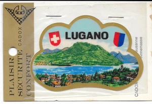 1970 - LUGANO - ADESIVO PER AUTOMOBILE - CON VELINA E CONFEZIONE ORIGINALE - Picture 1 of 1