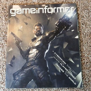 GAME INFORMER Magazine #265 Deus EX Mankind Divided Mortal Kombat Evolve - Foto 1 di 9