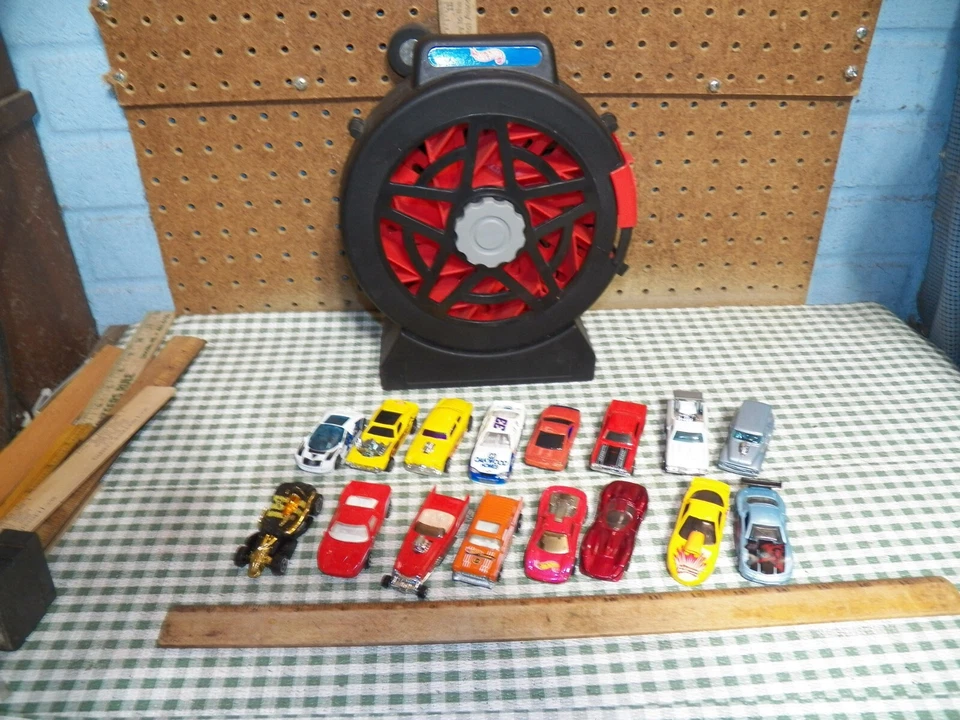 1998 MATTEL "HOT WHEELS" Sto & Go Tire Shaped Car Carrier Launcher w/ 16 Cars - Image 1 of 4