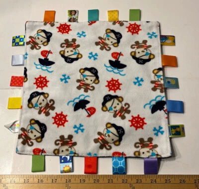 Taggies Mono Pirata Lovey Respaldo Azul Marino Con Etiquetas Varios Colores Foto 1 de 4