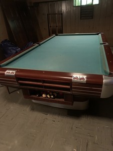 Brunswick vintage 9ft. tournament size pool table with cue holder