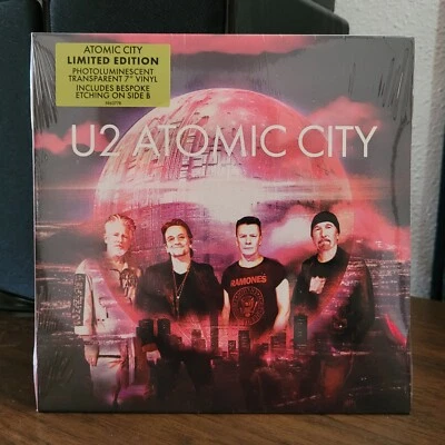 U2 Atomic City • ЗАПЕЧАТАННЫЙ • фотолюминесцентный прозрачный 7-дюймовый винил • 602458637786  - Изображение 1 из 2