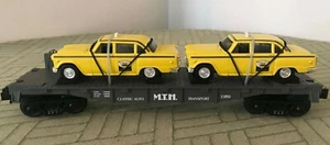 RAIL KING BY M.T.H. 30-7625 AUTO TRANPORT FLAT CAR WITH ERTL ’59 TAXIS, NEW - Picture 1 of 11