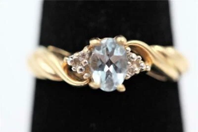 Anillo de compromiso con halo de aguamarina creado en laboratorio de 1 quilate enchapado en oro amarillo de 14 quilates Foto 1 de 4