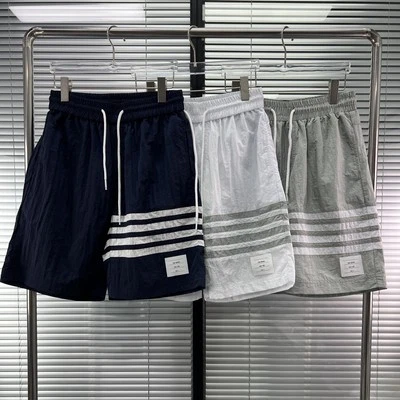 Pantalones Cortos Informales Thom Browne Hombres/Mujeres Clásicos Cuatro Barras a Rayas Exterior Foto 1 de 4