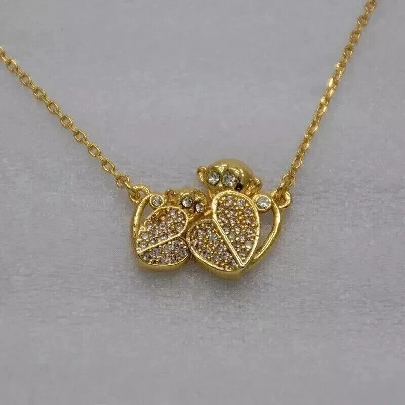 Pingente simulado de diamante 2 quilates corte redondo mãe e bebê macaco folheado a ouro amarelo 14k - Imagem 1 de 4