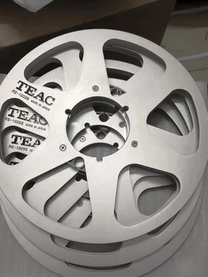 Par de carretes de metal plateados de teca de 10,5 pulgadas Foto 1 de 4