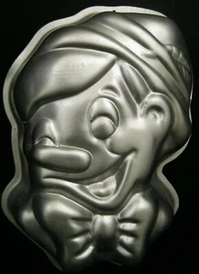 PINOCCHIO PUPPET DISNEY METAL CAKE PAN SMALL MOLD DESSERT WILTON 515 701 1976 - Picture 1 of 4