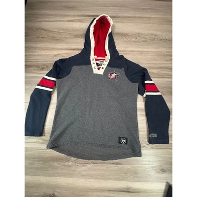 Columbus Blue Chaquetas 47 Marca NHL Hockey Sudadera con Capucha Con Cordones Medio Gris Azul Marino Rojo Foto 1 de 4
