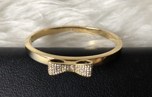 NUOVO bracciale Kate Spade NY cristallo fiocco cerniera colore oro con ricevuta