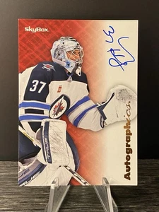 2023-24 E-X 2000 Skybox Autographics Connor Hellebuyck Auto #AG-CH Jets - Picture 1 of 2