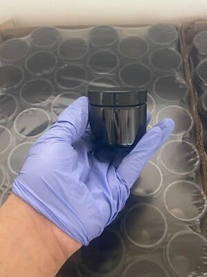 36 2oz Amber Glass Jars With Black lids - Image 1 of 4