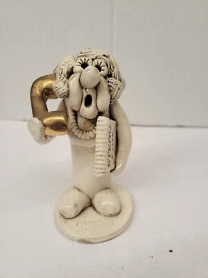 Almohadilla de escultura de silbato de secretario Joe Peck de colección y cerámica artística dorada para teléfono Foto 1 de 4