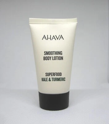 Loción corporal suavizante AHAVA con superalimento col rizada y cúrcuma viaje mini 1,3 oz. Foto 1 de 2