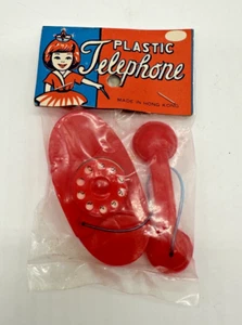 Juguete telefónico de plástico de los años 60 rojo giratorio hecho en Hong Kong nuevo de colección - Imagen 1 de 3