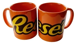 Galerie Reese's Cup Coffee Mugs Lot of 2 Orange Spellout Logo Mug Pieces - Picture 1 of 6