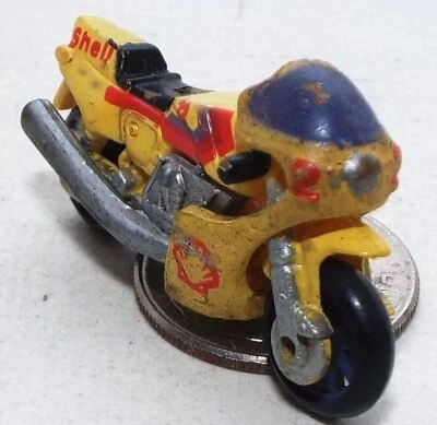 Very Small Micro Machine Ducati 900 Motorcycle in Yellow marked Shell - Image 1 of 3