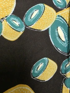 Lularoe Kids L/XL Leggings NWOT- Black background with KIWI fruit RARE - Picture 1 of 3