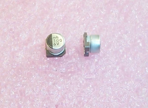 QTY (100) 100uf 6.3V SMD ELECTROLYTIC CAPACITORS 6.3x5.4 UWX0J101MCR1GB NICHICON - Picture 1 of 2