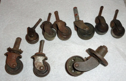 9 VINTAGE ANTIQUE CAST IRON & WOODEN WHEEL CASTERS Cover