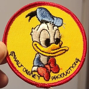 VINTAGE UNBENUTZT WALT DISNEY PRODUCTIONS BESTICKT AUFBÜGLER DONALD DUCK PATCH - Bild 1 von 5