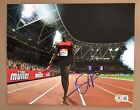 Usain Bolt Signed 8x10 Photo. Jamaica Olympics. Track & Field Beckett COA. A35