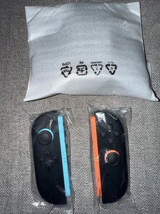 Nintendo Switch Joy-Con 2 (L)/(R) Light Blue/Light Red W/ Grip And Straps New - Picture 1 of 4