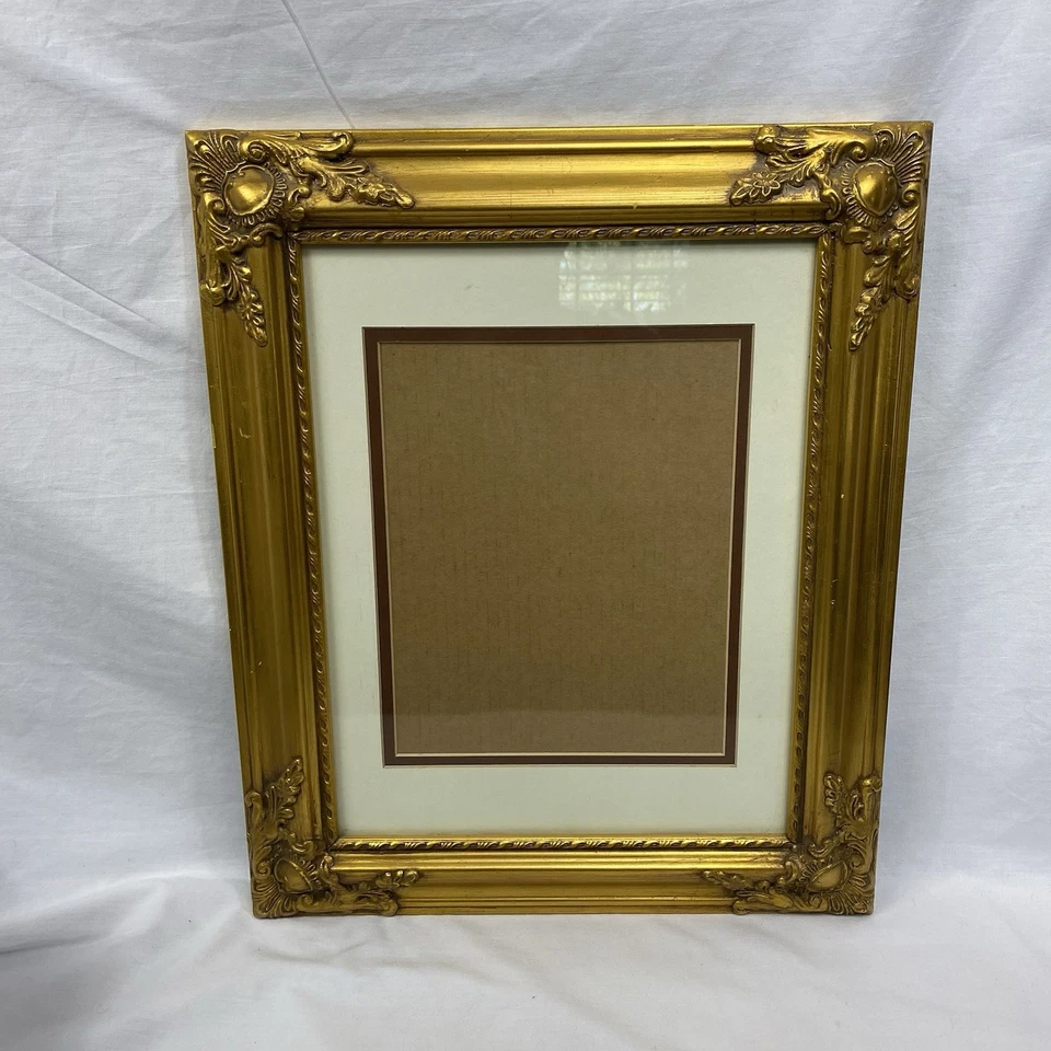 Marco de culpa dorado ornamentado de madera sintética con vidrio 18x14,75 interior 11x14 mate 8x10 Foto 1 de 4