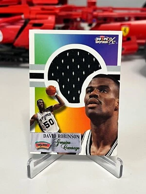 1999-00 Skybox NBA Hoops Decade David Robinson Genuine Coverage Jersey 1:8 - Image 1 of 2