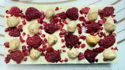 White Chocolate Bar Sweet & Sour  taste Raspberry & Hazelnut on top  100g . - Image 1 of 4