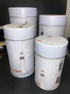 Set of 4 Lighthouse Decorated Tin Canisters 10”, 9”, 8” and 6.5” Tall - Picture 1 of 9