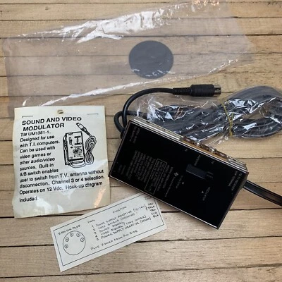 Texas Instruments Audio And Video Modulator Adapter For TI99 Or Video Games NEW - Image 1 of 4