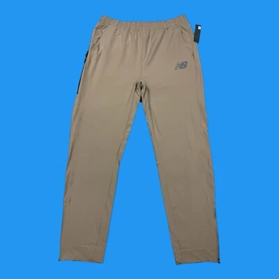 Pantalones de chándal New Balance para hombre talla XL forrados de malla con todo movimiento beige Foto 1 de 4