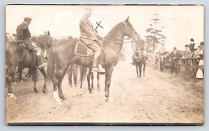 Postcard Unidentified RPPC Man on Horseback, Horses, Onlookers Beyond Fence - Picture 1 of 2