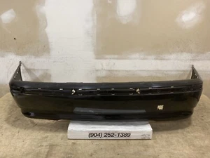 2002 2003 2004 2005 BMW 3 Serie 325i 325xi 330i 330xi Base Rear Bumper Cover OEM - Picture 1 of 12