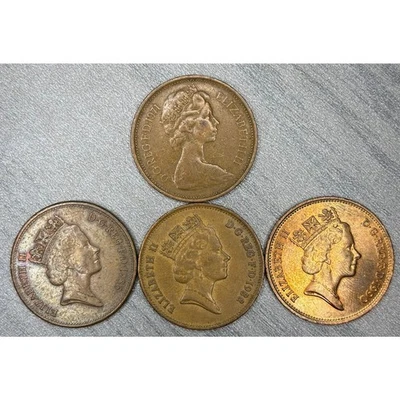 Lote de monedas de 2 peniques del Reino Unido: 1971 “Nuevo penique” y 1986, 1988, 1990 “Dos peniques” circuladas Foto 1 de 2