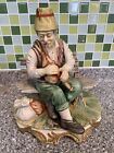 Vintage CAPODIMONTE Oriental Man Playing a Bagpipe on a bench - Immaculate