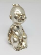 Vintage pewter Paperweight child on a potty ornament