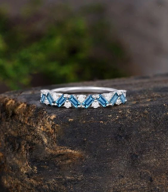 0.60TCW Simulated Blue Topaz & Moissanite In 10K White Gold Women Eternity Ring - Image 1 of 4