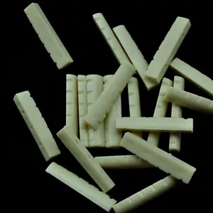 Un montón de 50 piezas Guitarra acústica Slotted Nuts Upper Saddles Bridge Ivory White - Imagen 1 de 3