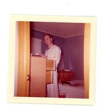 Man in pajamas in bedroom vintage   snapshot found color photo