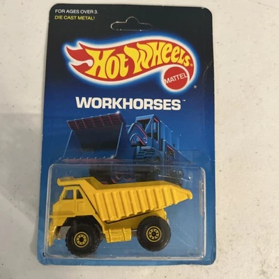 1987 Hot Wheels CAT DUMP TRUCK with GOLD WHEELS WORKHORSES NIP H463 - Image 1 of 4