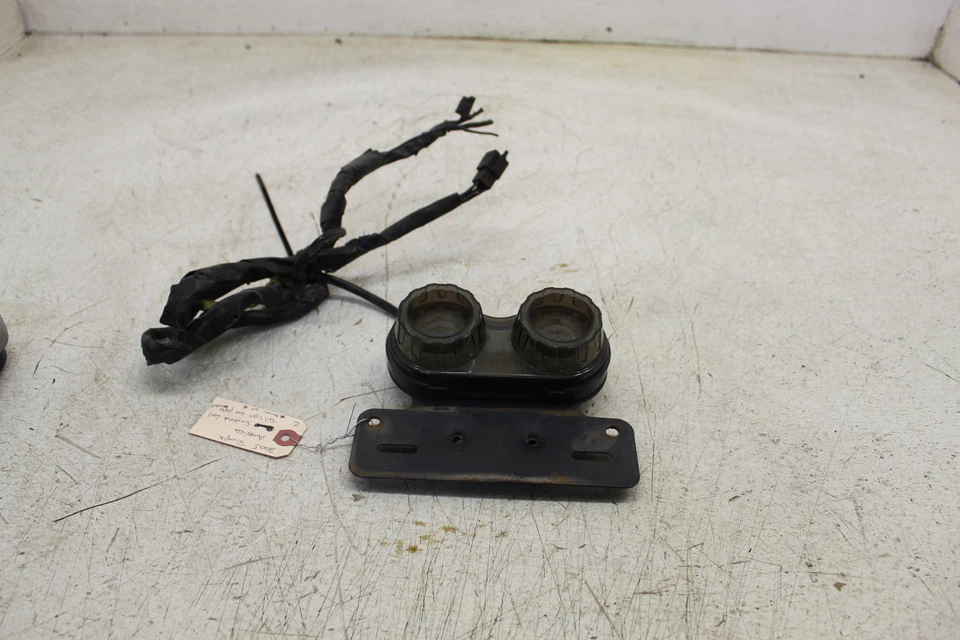 TRIUMPH AMERICA 2005 OEM LUZ TRASERA LUZ DE FRENO TRASERA LENTE AHUMADA B23D Foto 1 de 4