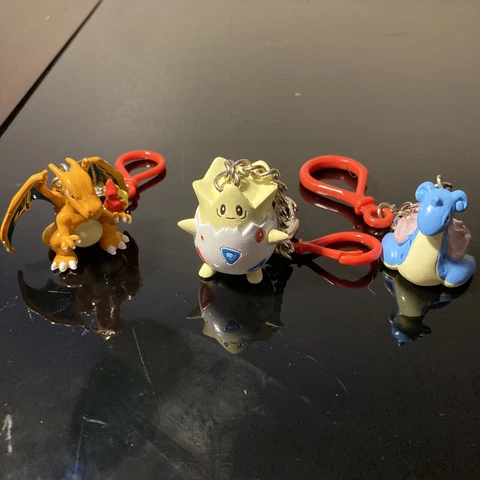 Togepi, Laprus & Charizard Pokemon Keychain Figures BFI (1999 & 2000) Cover